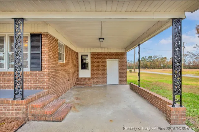 a view of an entryway with a ceiling fan