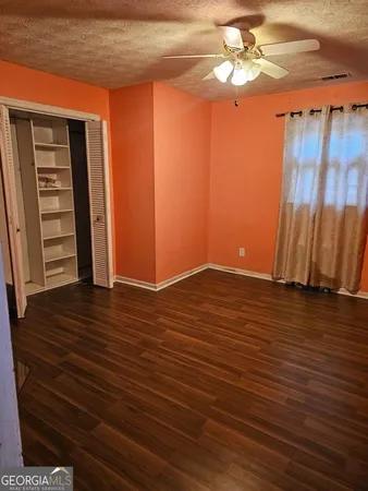 a view of a livingroom with wooden floor