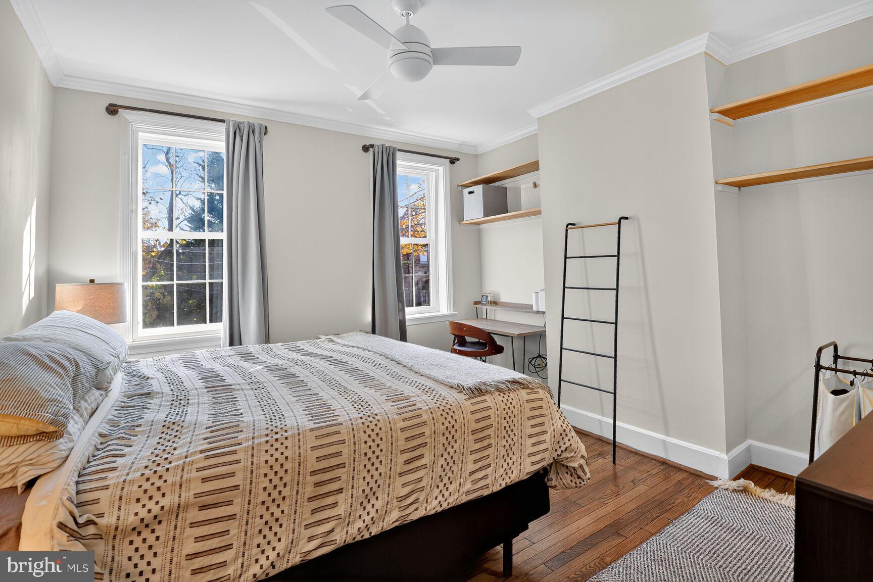 220 North Patrick Street Alexandria, VA 22314 - Photo 11 of 15 a bedroom with a bed and wooden floor