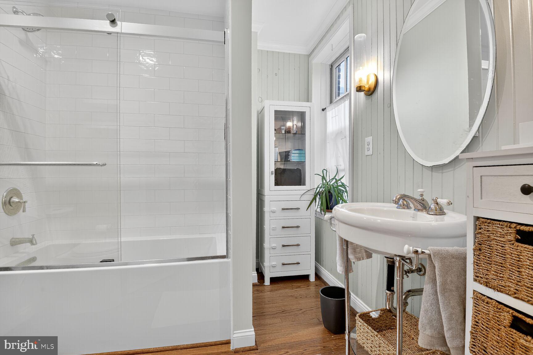 220 North Patrick Street Alexandria, VA 22314 - Photo 12 of 15 a bathroom with a sink and a mirror