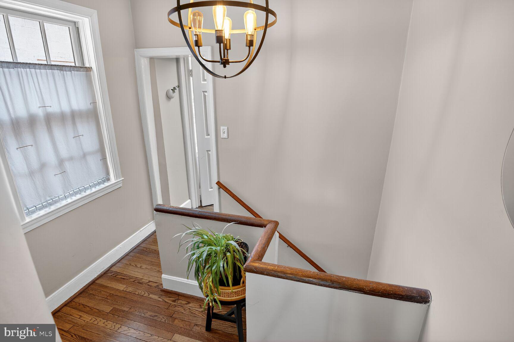220 North Patrick Street Alexandria, VA 22314 - Photo 10 of 15 a view of staircase with white walls and a window