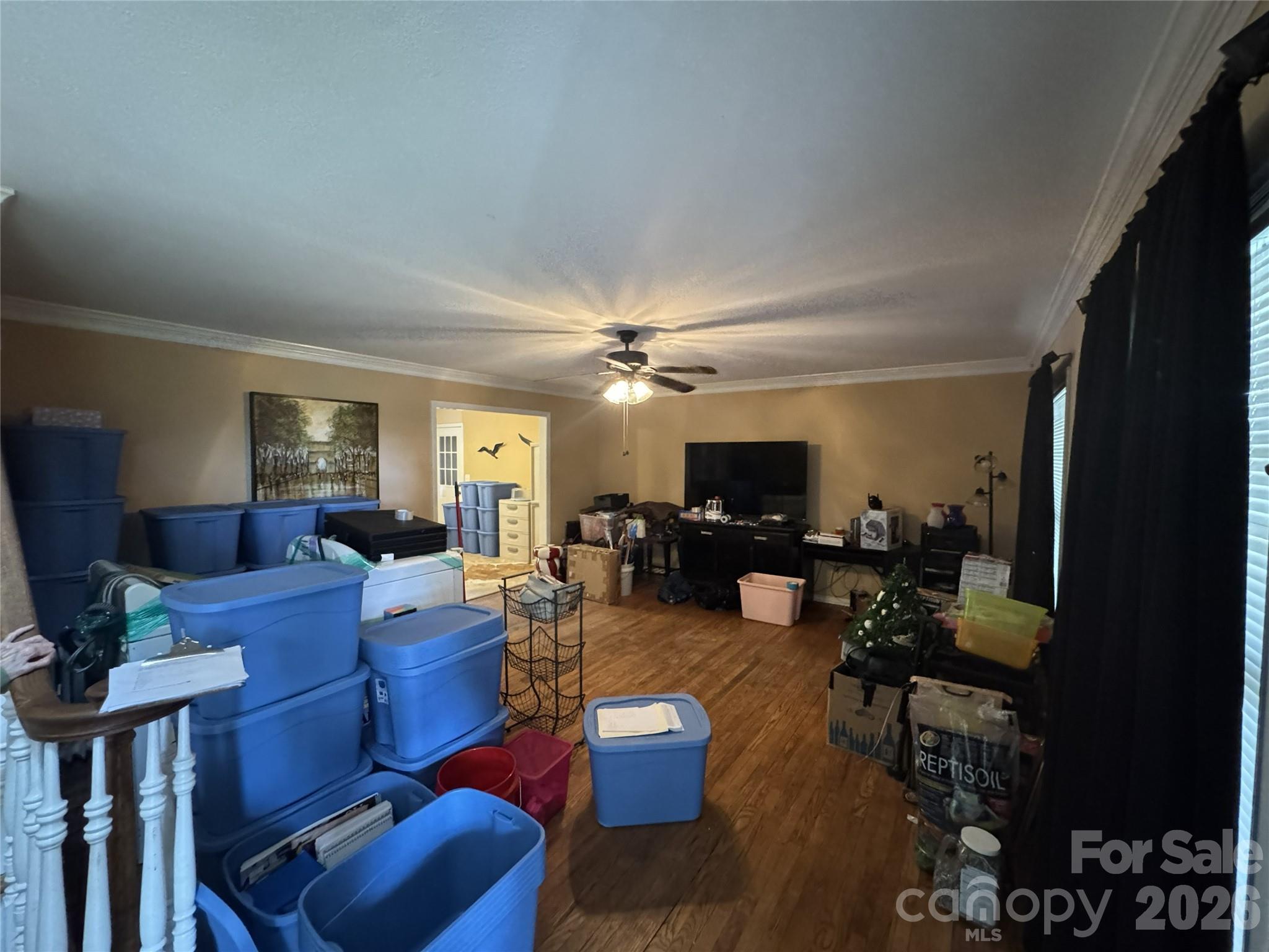 8441 Shelley Mullis Road Fort Mill, SC 29707 - Photo 4 of 23 a living room with furniture a flat screen tv and a window