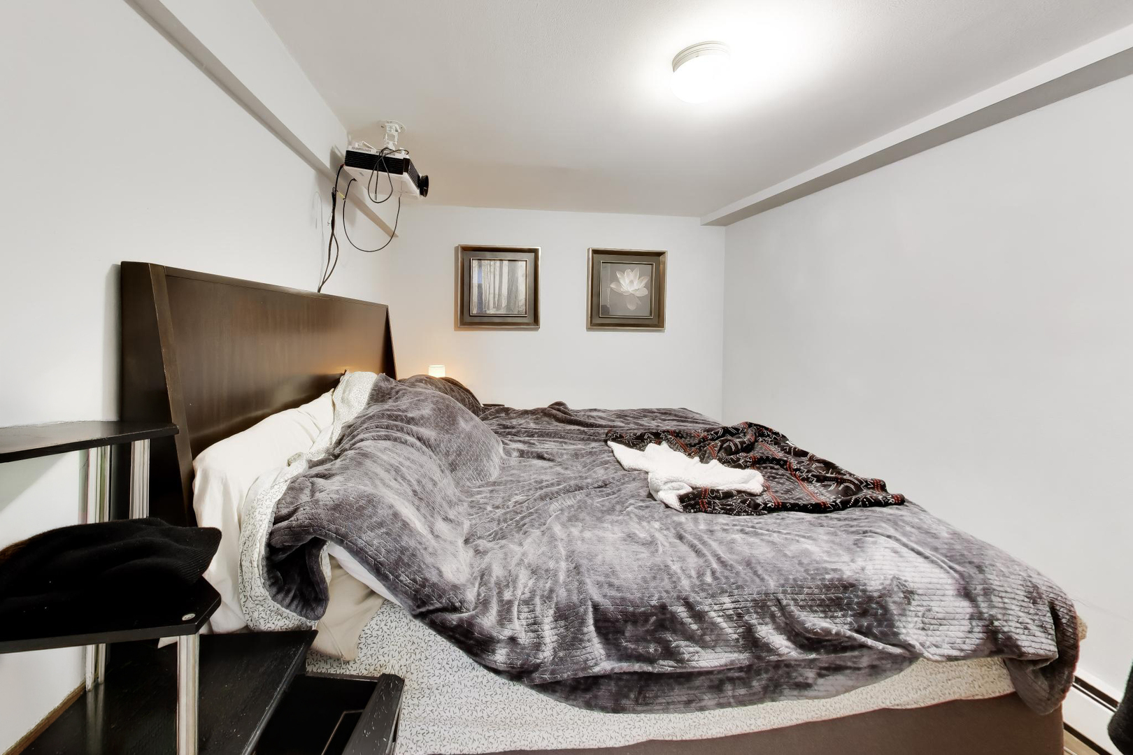 5057 West Dakin Street, Unit G Chicago, IL 60641 - Photo 11 of 19 a bedroom with a bed and a mirror