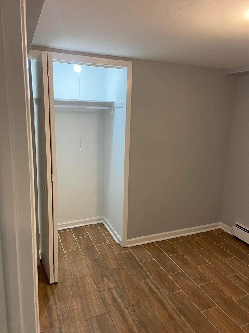 5057 West Dakin Street, Unit G Chicago, IL 60641 - Photo 9 of 19 a view of a room with wooden floor
