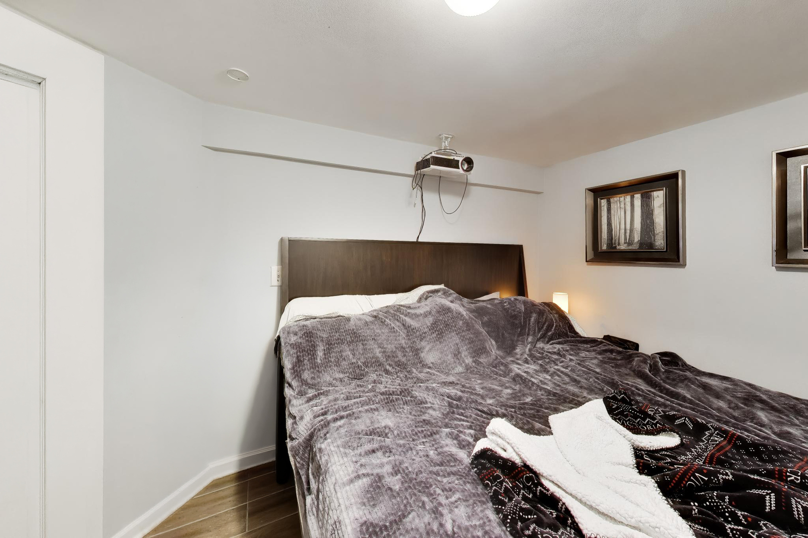 5057 West Dakin Street, Unit G Chicago, IL 60641 - Photo 10 of 19 a bedroom with a bed and wooden floor