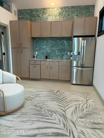 a kitchen with a sink appliances and cabinets