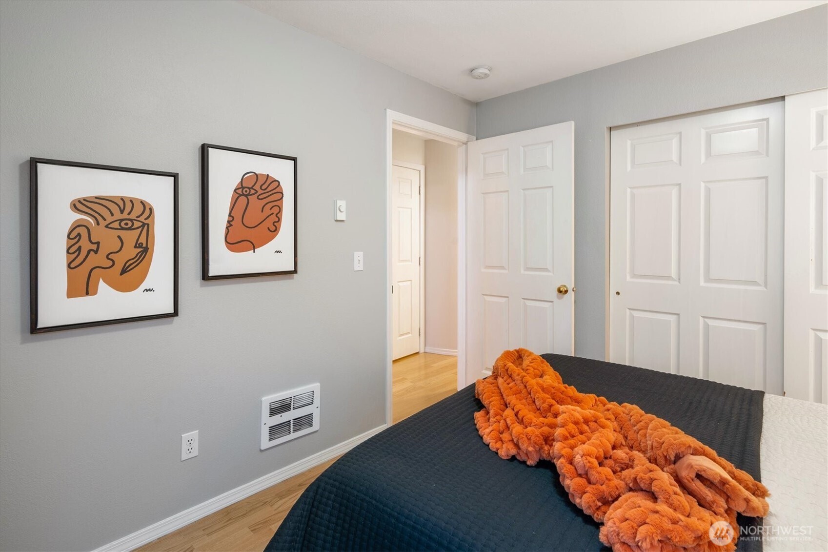 2024 Northwest 57th Street, Unit 201 Seattle, WA 98107 - Photo 16 of 29 a bedroom with a bed and painting on the wall