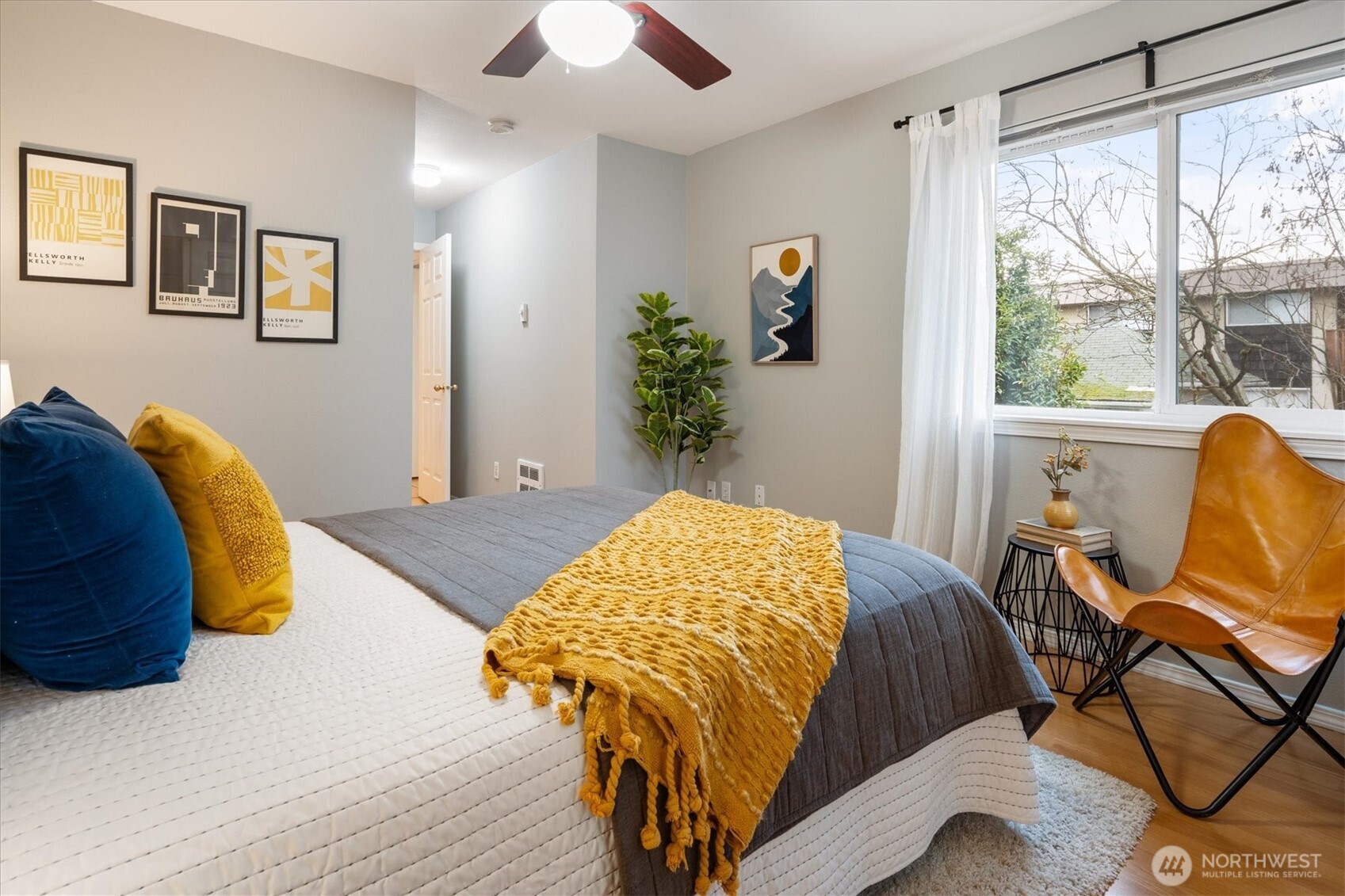 2024 Northwest 57th Street, Unit 201 Seattle, WA 98107 - Photo 19 of 29 a bedroom with a bed and a window