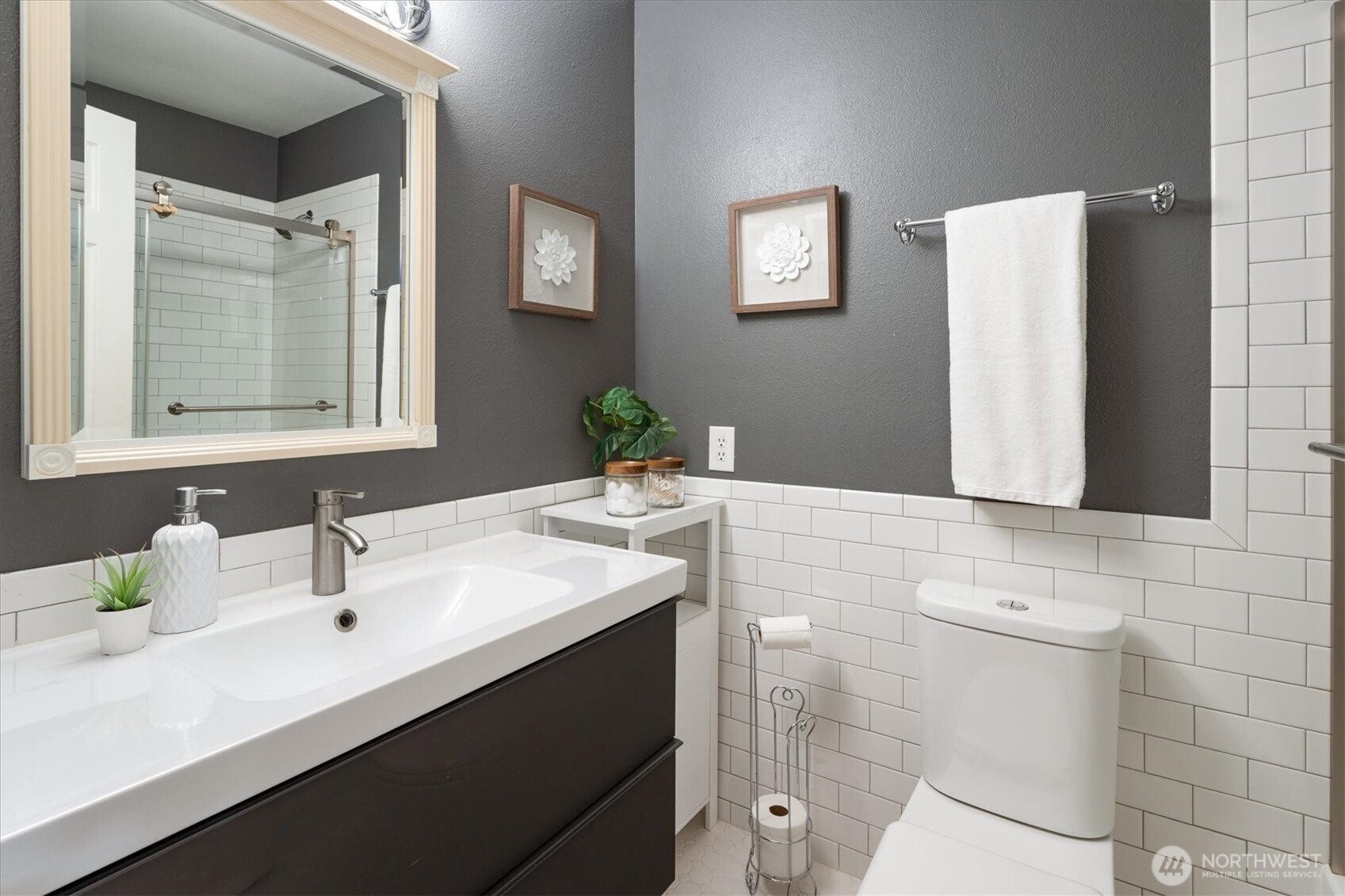 2024 Northwest 57th Street, Unit 201 Seattle, WA 98107 - Photo 20 of 29 a bathroom with a sink and a mirror