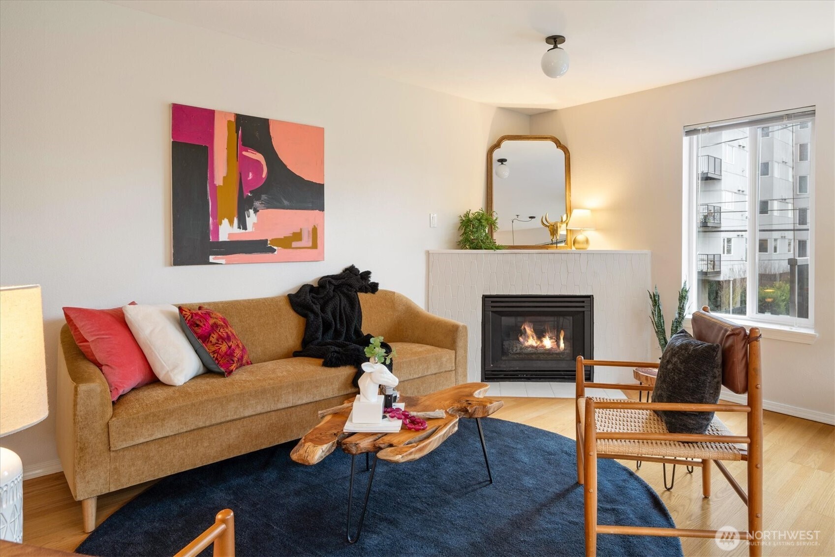 2024 Northwest 57th Street, Unit 201 Seattle, WA 98107 - Photo 2 of 29 a living room with furniture and a fireplace