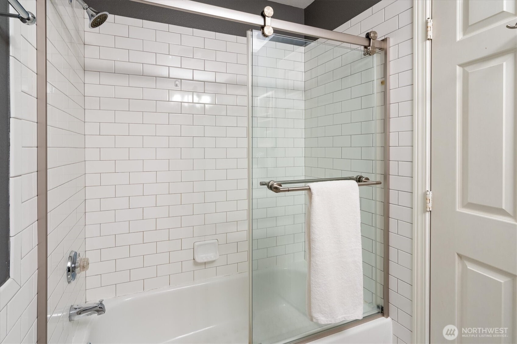 2024 Northwest 57th Street, Unit 201 Seattle, WA 98107 - Photo 21 of 29 a bathroom with a shower and a bath tub