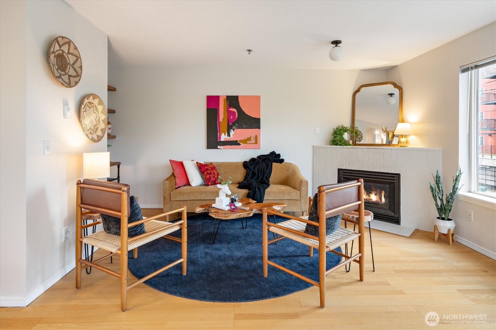 2024 Northwest 57th Street, Unit 201 Seattle, WA 98107 - Photo 3 of 29 a living room with furniture a rug and a fireplace