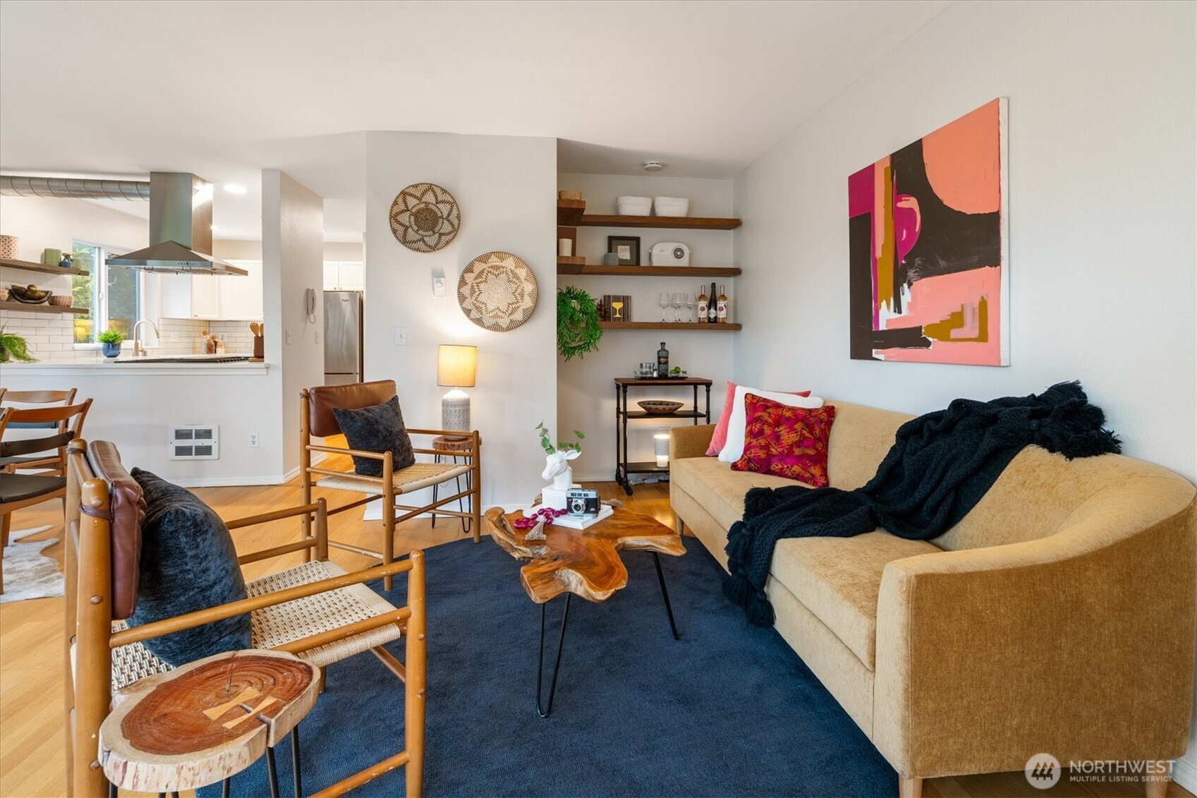 2024 Northwest 57th Street, Unit 201 Seattle, WA 98107 - Photo 4 of 29 a living room with furniture and wooden floor