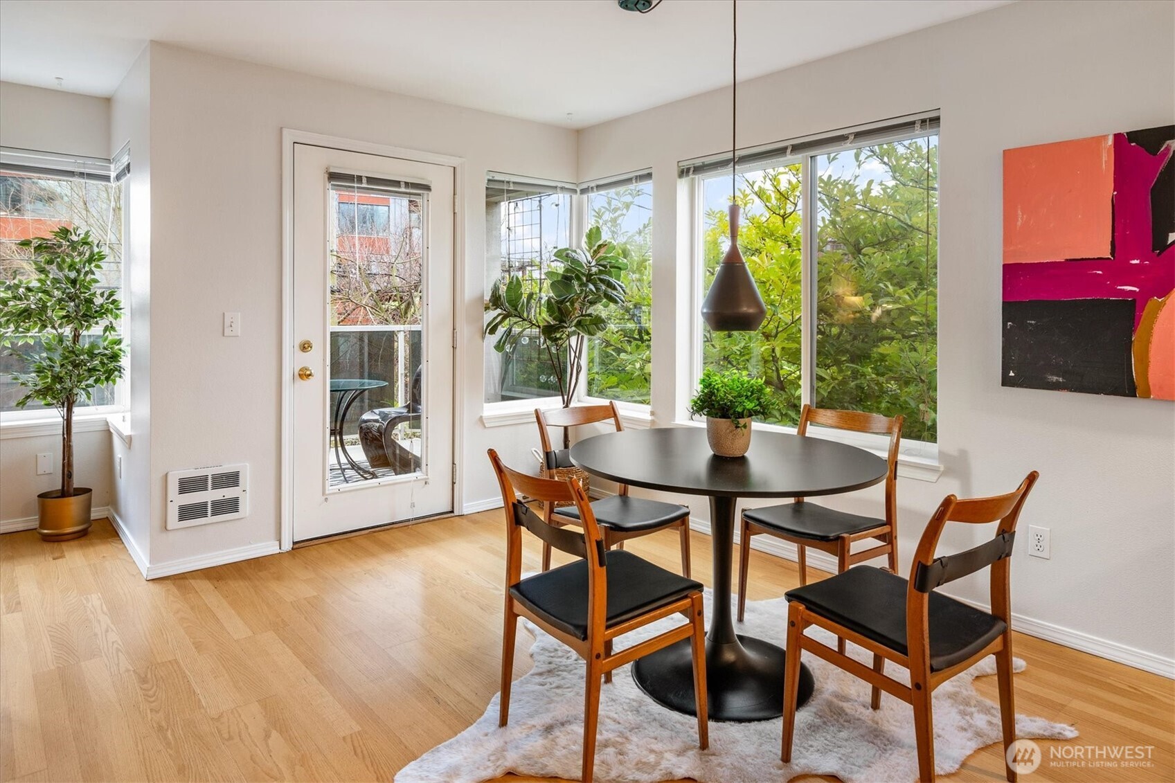 2024 Northwest 57th Street, Unit 201 Seattle, WA 98107 - Photo 6 of 29 a dining room with furniture and wooden floor