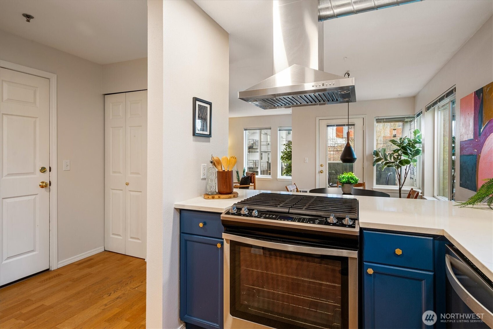 2024 Northwest 57th Street, Unit 201 Seattle, WA 98107 - Photo 10 of 29 a kitchen with stainless steel appliances granite countertop a stove and a sink