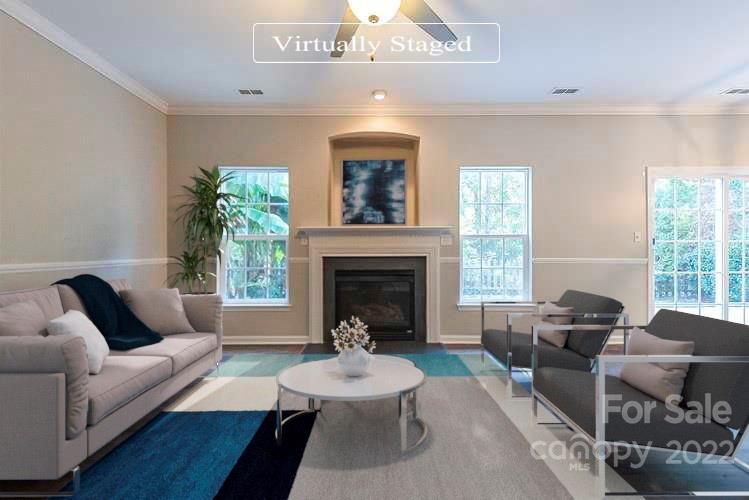 7632 Black Hawk Lane Tega Cay, SC 29708 - Photo 2 of 16 a living room with furniture and a fireplace