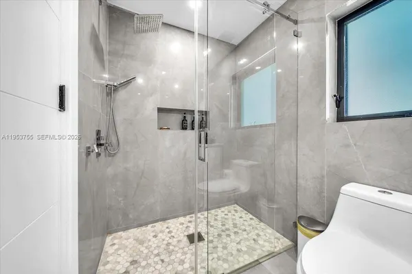 a bathroom with a sink and a shower