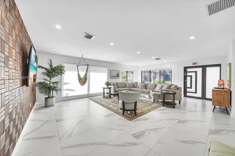 a living room with furniture and a table