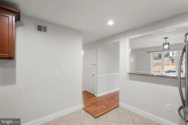 a view of kitchen with furniture and wooden floor
