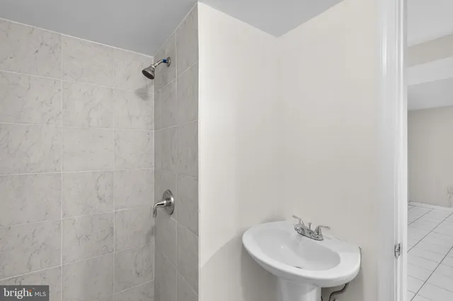 a kitchen with granite countertop cabinets stainless steel appliances and a counter space