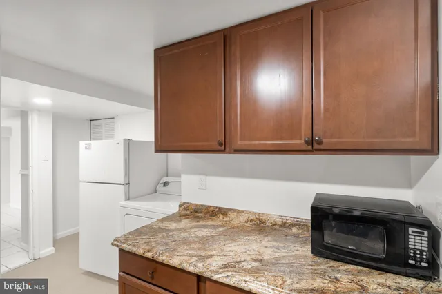 a kitchen with a sink stove and refrigerator
