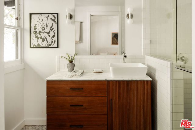 a bathroom with a sink and a mirror