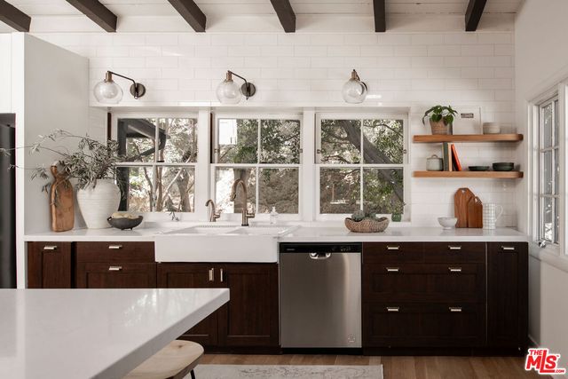 a kitchen with a sink and cabinets