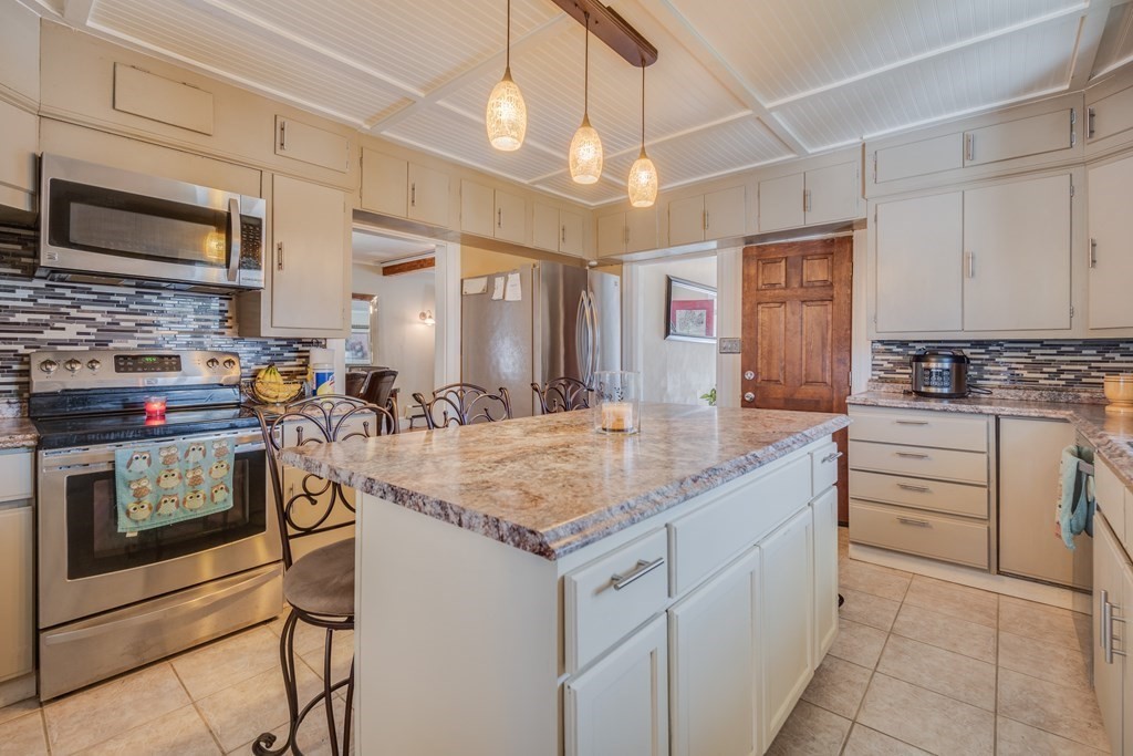 39 Hardwick Road Hardwick, MA 01031 - Photo 14 of 27 a kitchen with stainless steel appliances granite countertop a sink and cabinets