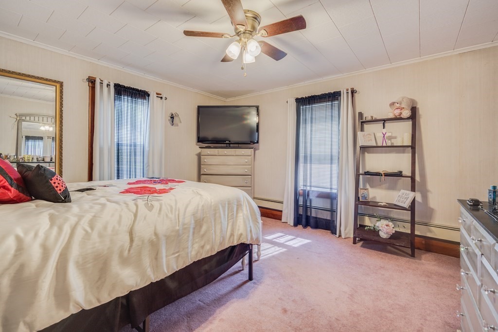 39 Hardwick Road Hardwick, MA 01031 - Photo 24 of 27 a spacious bedroom with a bed and a flat screen tv