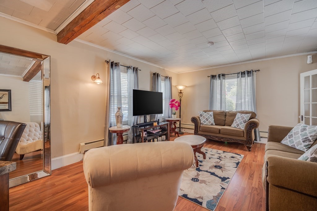 39 Hardwick Road Hardwick, MA 01031 - Photo 8 of 27 a living room with furniture and a flat screen tv