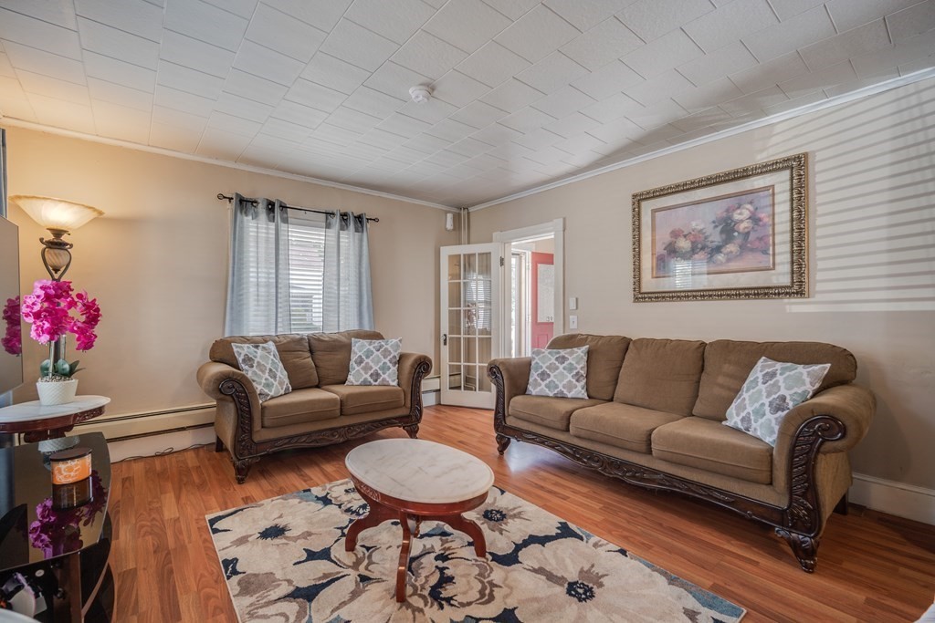 39 Hardwick Road Hardwick, MA 01031 - Photo 9 of 27 a living room with furniture and a potted plant