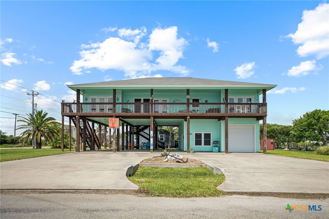 23 Macey Street Port O'Connor, TX 77982 - Photo 1 of 47 a front view of house with yard