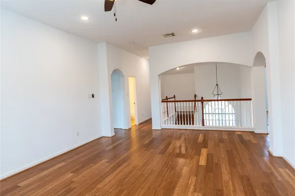 a view of a room with wooden floor