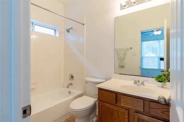 a bathroom with a sink a toilet and a bathtub