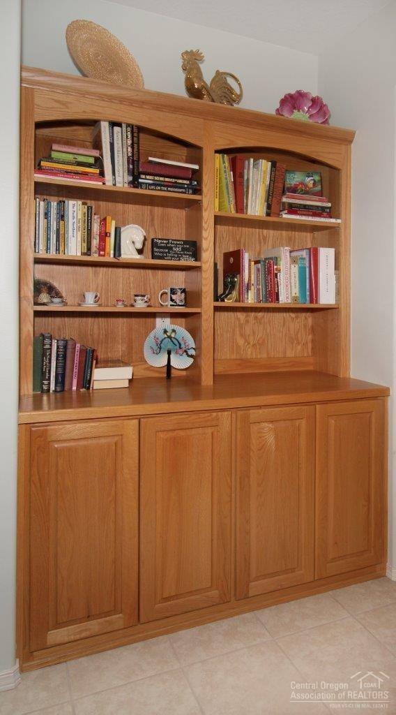 381 Southeast Soft Tail Loop Bend, OR 97702 - Photo 11 of 24 Built in bookcase and cabinets. A very n
