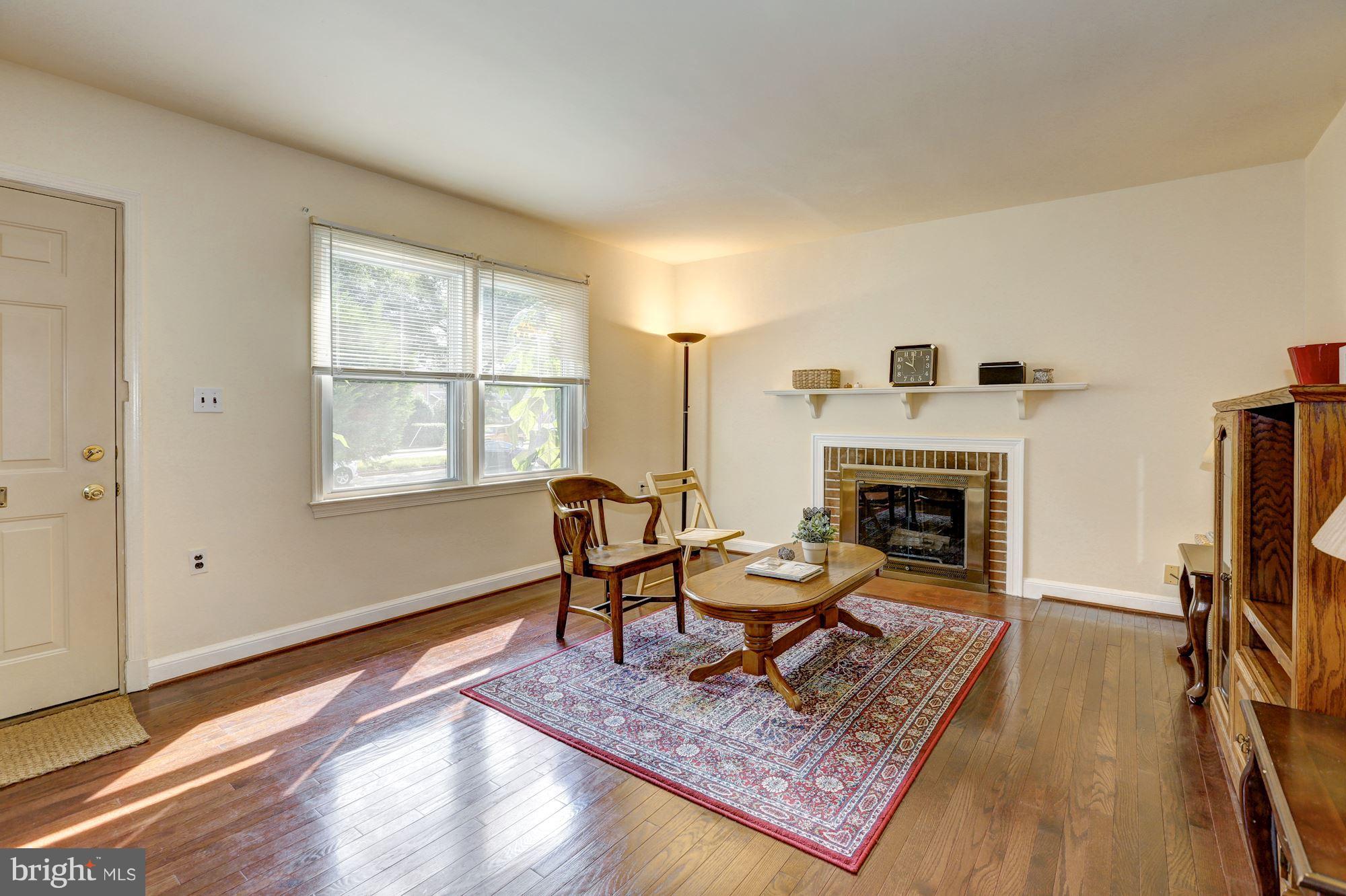 9428 Old Georgetown Road Bethesda, MD 20814 - Photo 2 of 30 Living Room w/Hardwood Floor & Fireplace