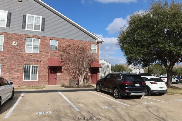 a view of a car parked in front of a house
