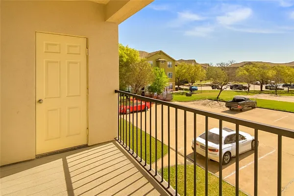a view of a balcony with an outdoor space