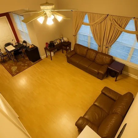 a roof deck with table and chairs