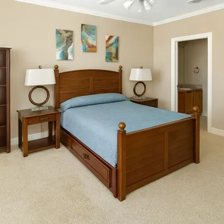a bedroom with a bed and a table