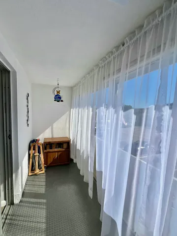 a view of room with stairs and furniture