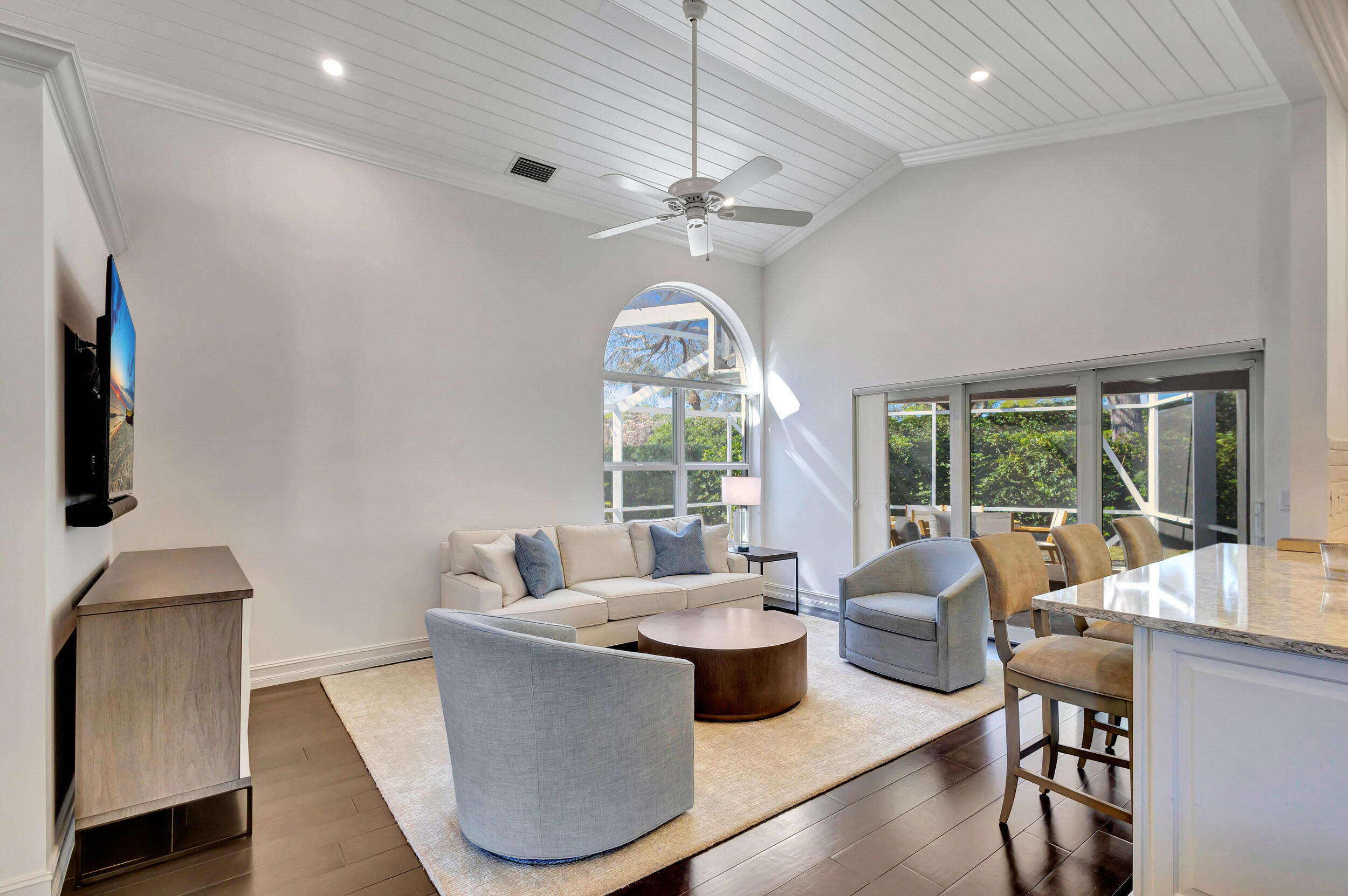 16501 Riverwind Drive Jupiter, FL 33477 - Photo 11 of 50 a dining room with furniture a chandelier and window