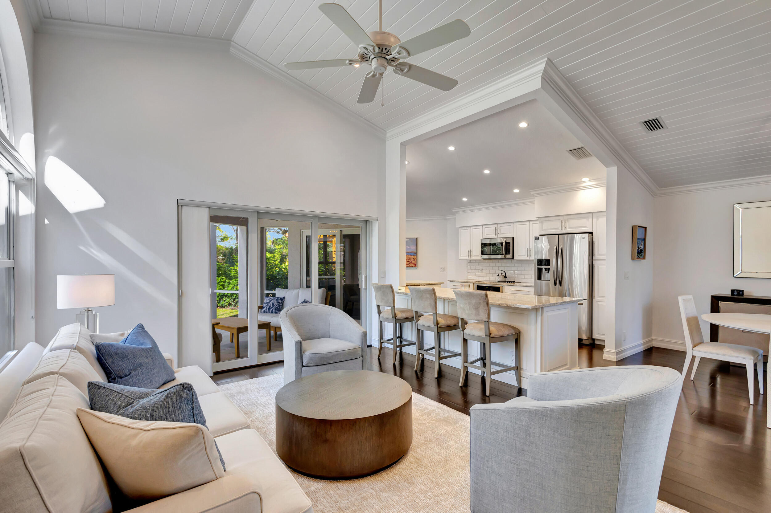 16501 Riverwind Drive Jupiter, FL 33477 - Photo 12 of 50 a living room with furniture and a large window