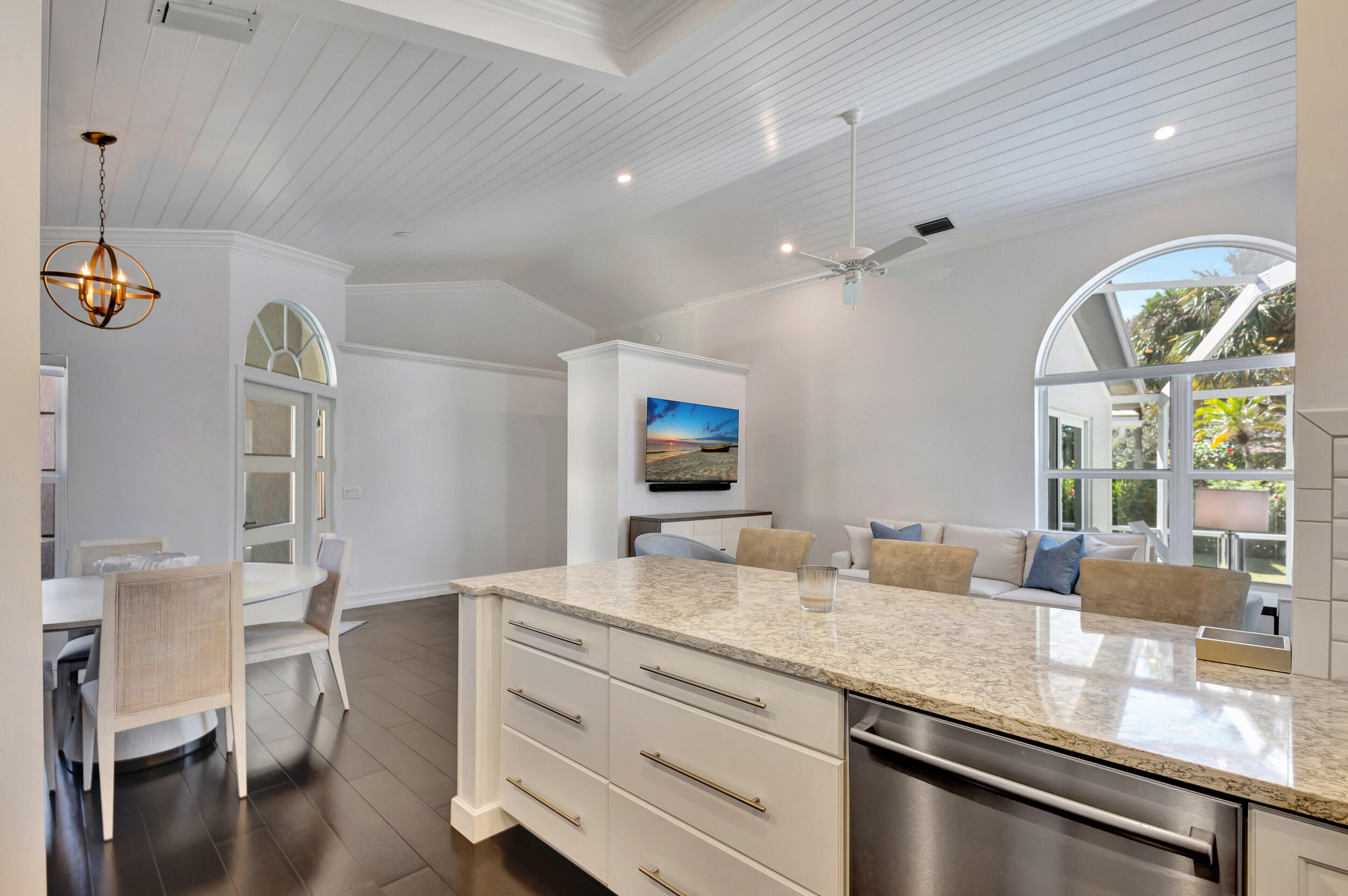 16501 Riverwind Drive Jupiter, FL 33477 - Photo 18 of 50 a bathroom with a granite countertop sink a large mirror and a window