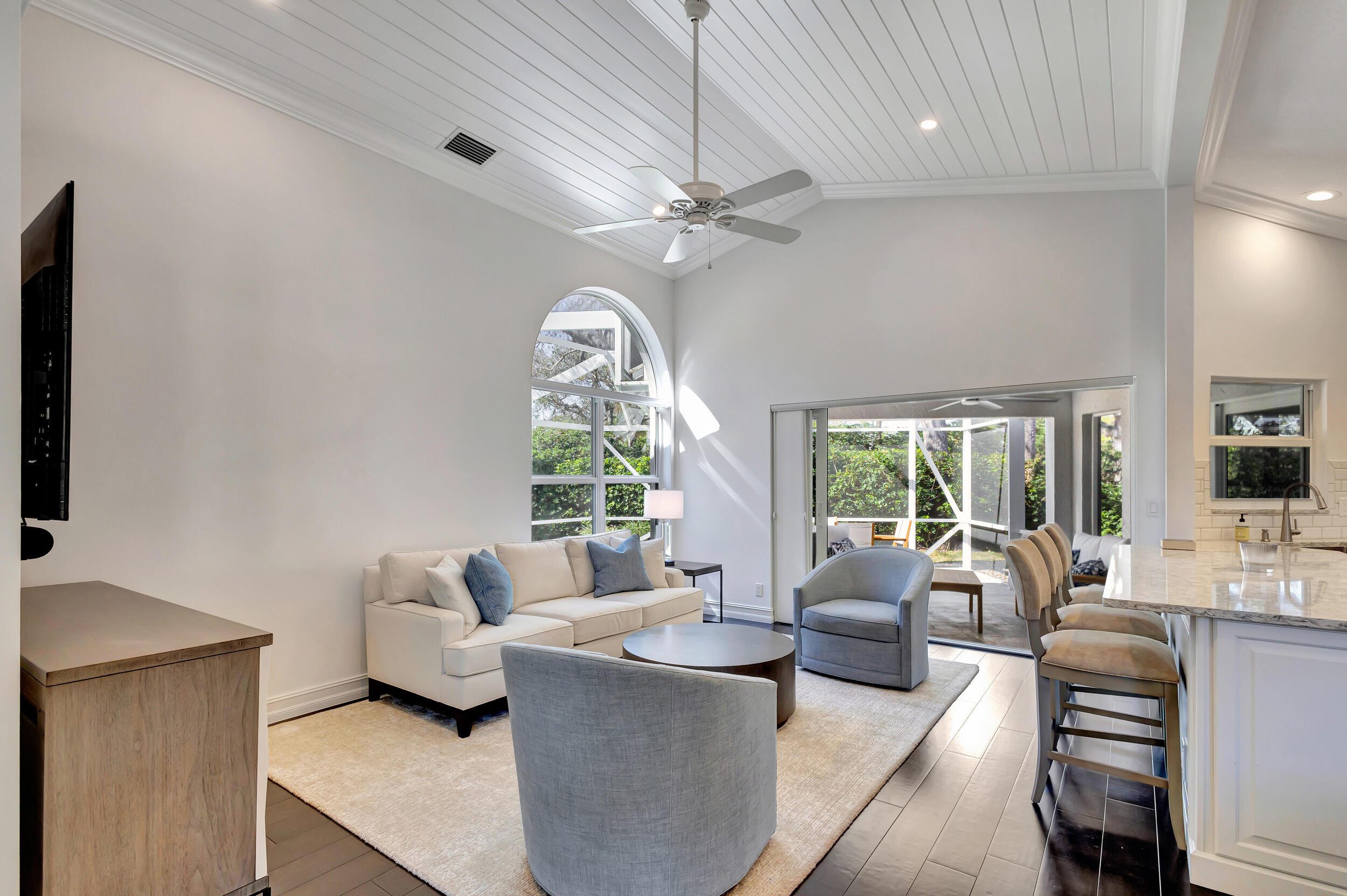 16501 Riverwind Drive Jupiter, FL 33477 - Photo 23 of 50 a living room with furniture and a large window