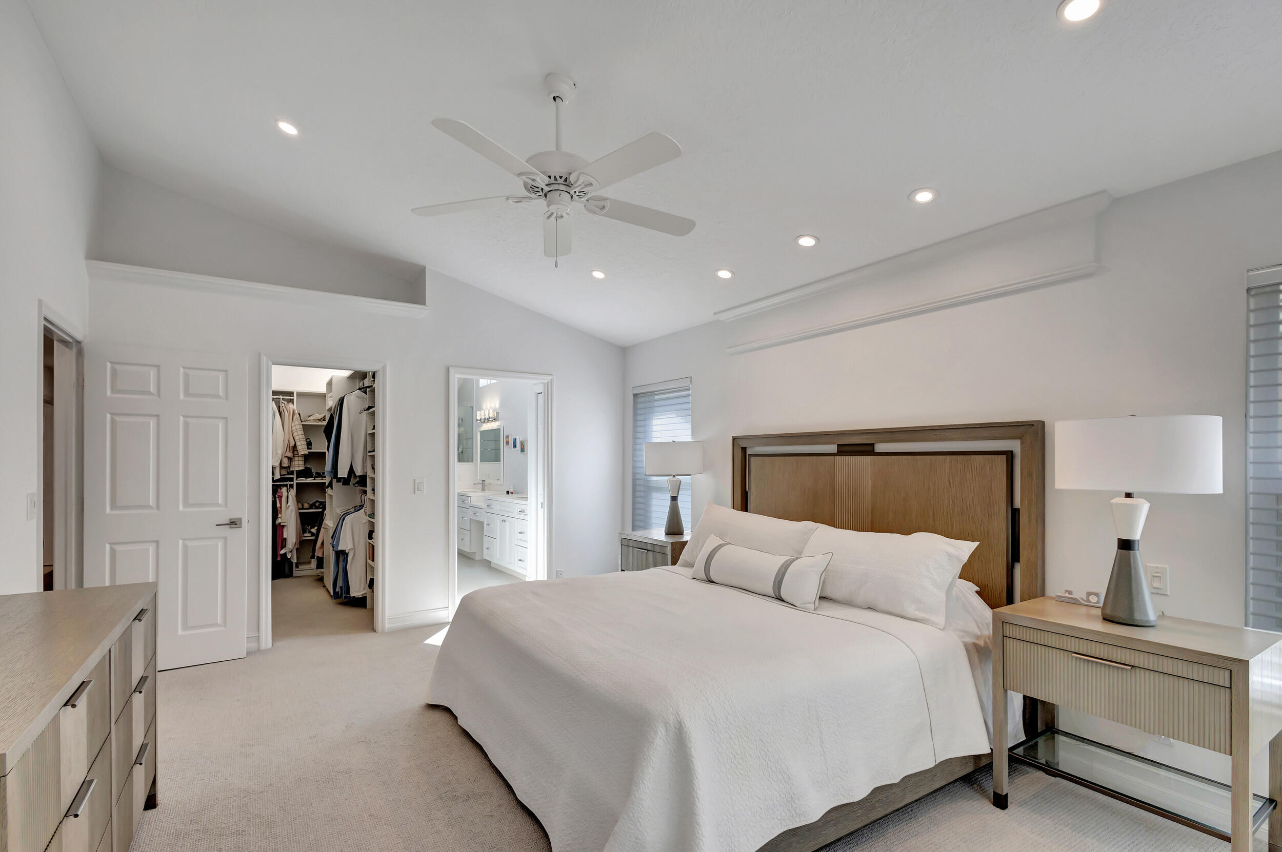 16501 Riverwind Drive Jupiter, FL 33477 - Photo 25 of 50 a bedroom with a large bed and closet
