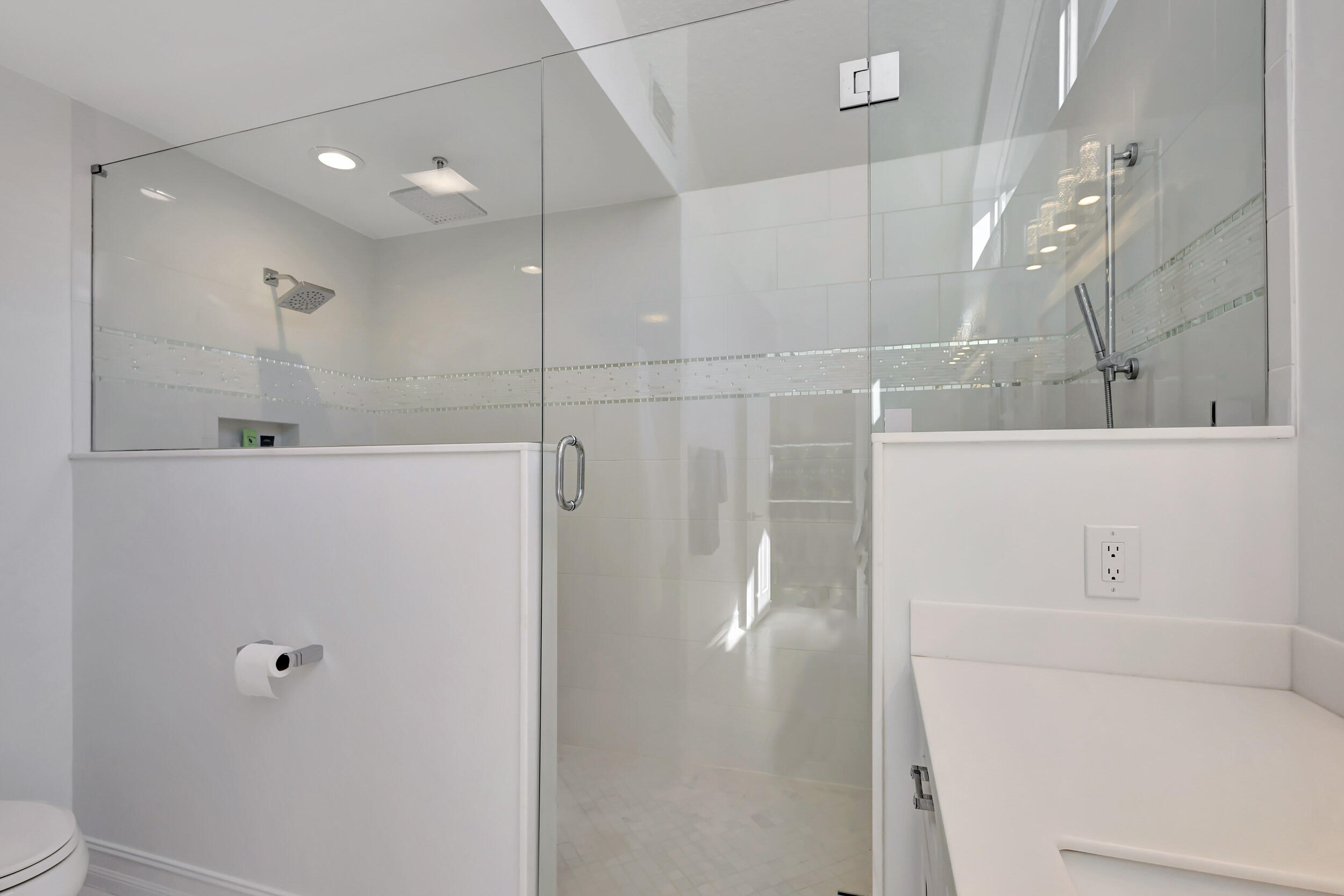 16501 Riverwind Drive Jupiter, FL 33477 - Photo 27 of 50 a bathroom with a shower and a toilet