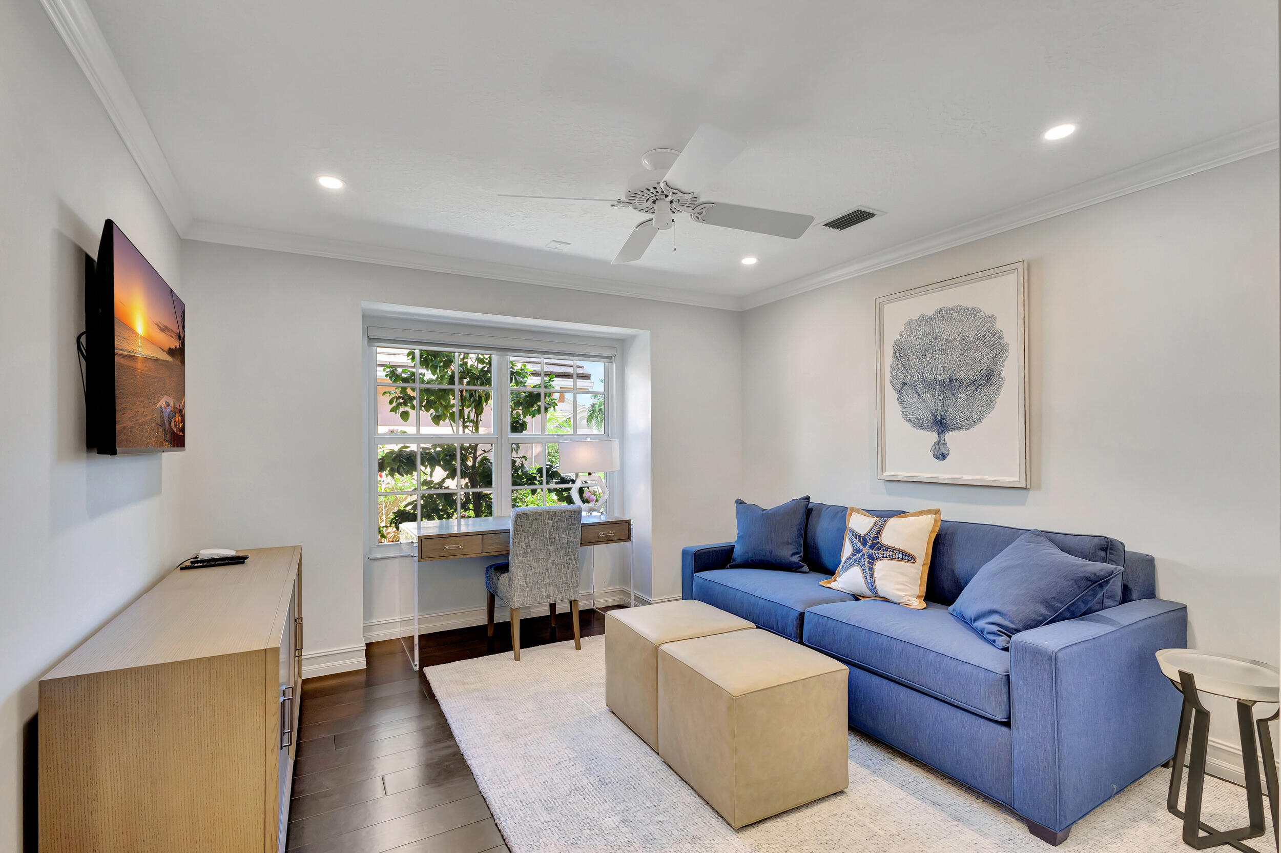 16501 Riverwind Drive Jupiter, FL 33477 - Photo 29 of 50 a living room with furniture and a window