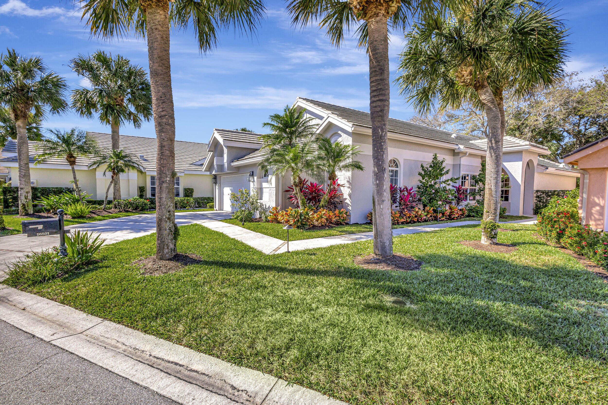 16501 Riverwind Drive Jupiter, FL 33477 - Photo 3 of 50 a view of a park with palm trees