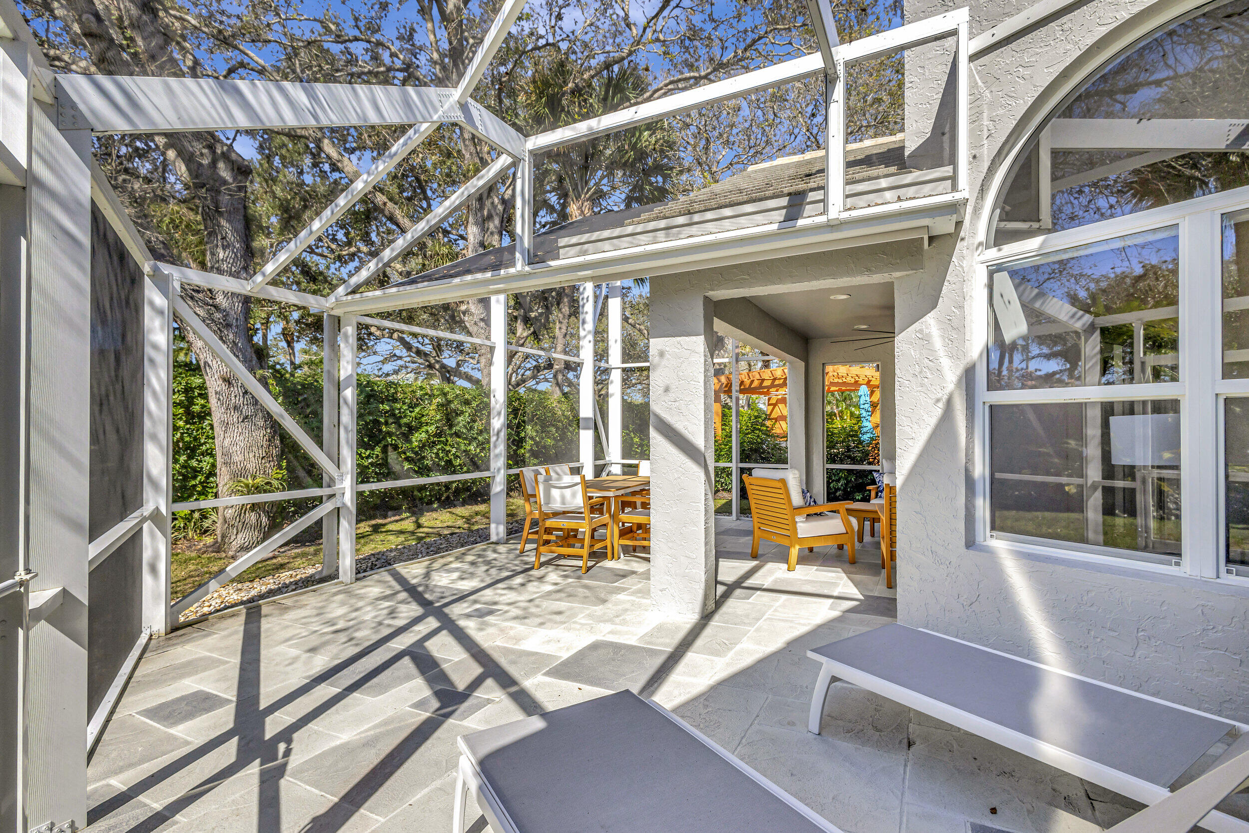 16501 Riverwind Drive Jupiter, FL 33477 - Photo 40 of 50 a view of a building with a large window and sitting area